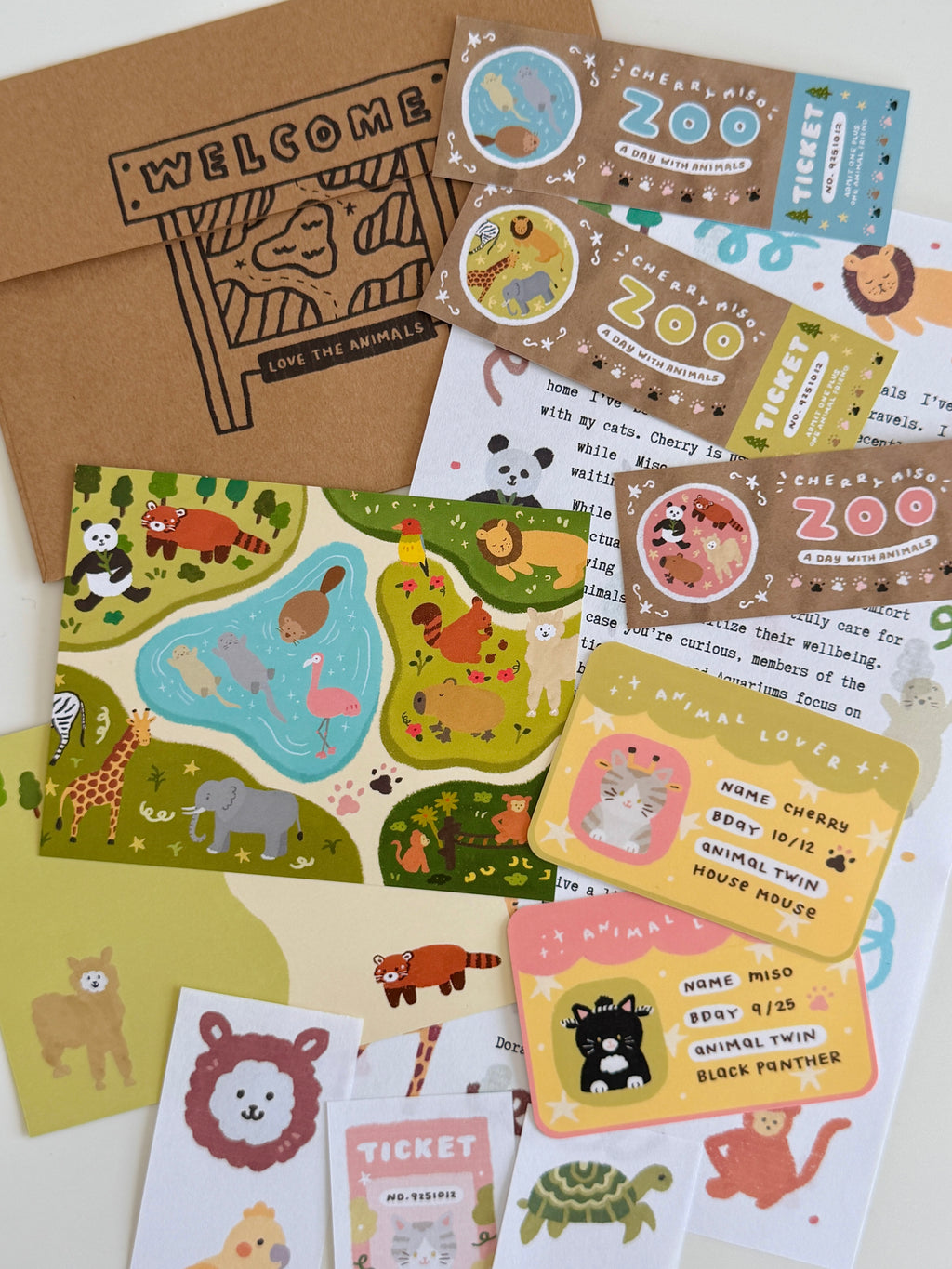 Collection of illustrated animal-themed postcards, stickers, and stationery pieces from the May edition of Cherry Miso Post featuring cute zoo and cat designs.