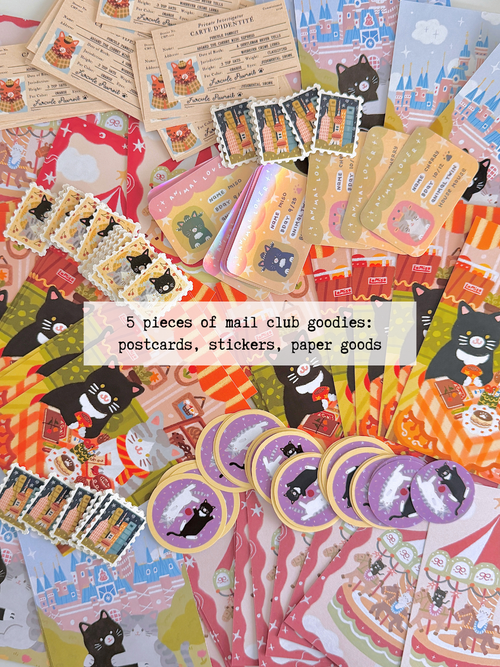 A flatlay of piles of cat-themed stationery items, including postcards, stickers, paper scraps, washi tape, and stamp stickers